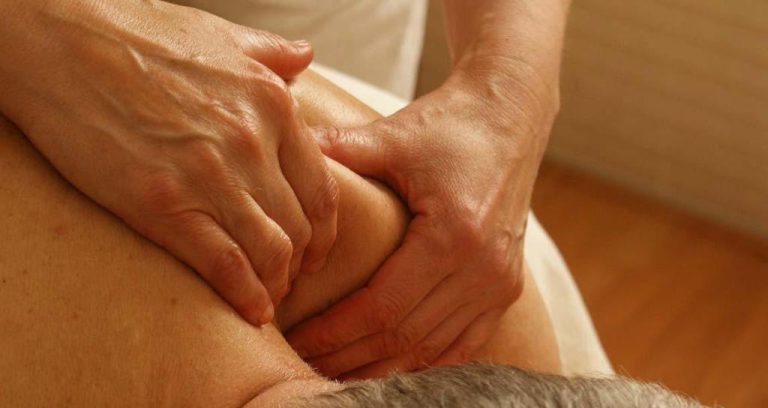 A banner showing a person receiving a therapeutic massage from a therapist